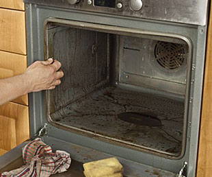 Direty Oven being Cleaned
